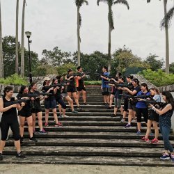 a team of staff having laser tag for their team building